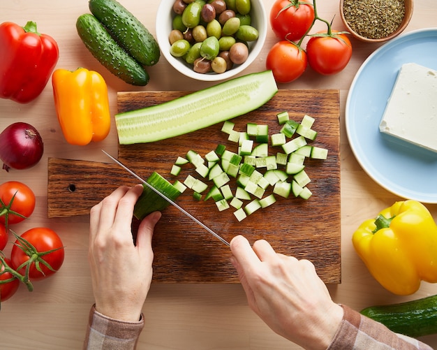 Step by step recipe for salad horiatiki, wooden board for cutting vegetables