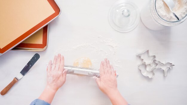 Step by step. Rolling out sugar cookie dough to make unicorn cookies.