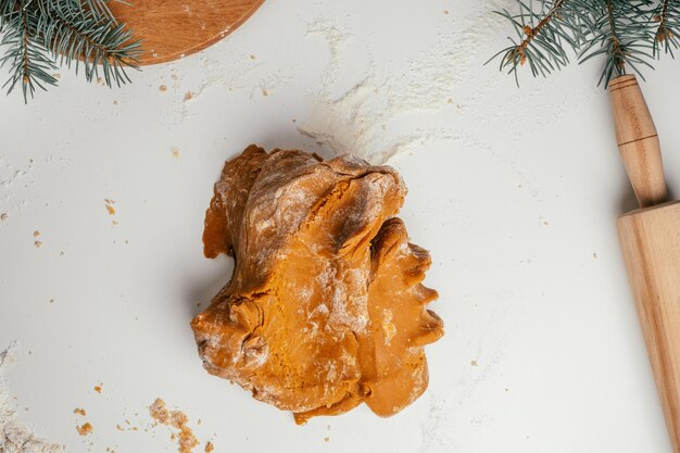 Step-by-step tutorial on baking Christmas gingerbread cookies. Step 10: Stir in flour as much as dough will take