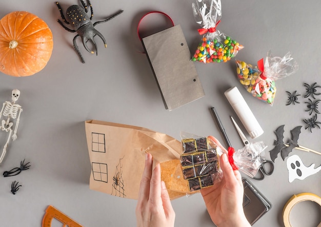 Step-by-step wrapping of a gift for Halloween