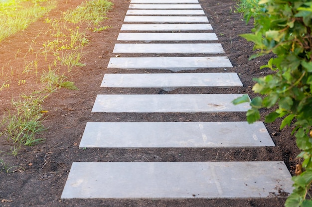 Step path made of concrete slabs in the Park. Step-by-step concrete path