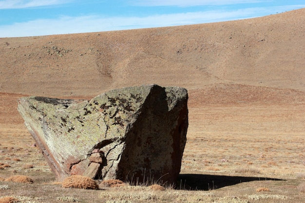 Steppe landscape and big rock Volcanic trough