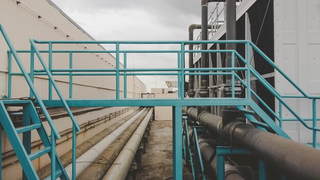 Steps and pipes on factory terrace