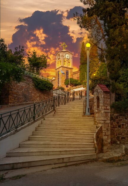 Steps to Saints Anargyri Holy Orthodox Church on island Evia in Greece at sunset