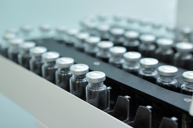 sterile capsules for injection bottles on the bottling line of the pharmaceutical plant