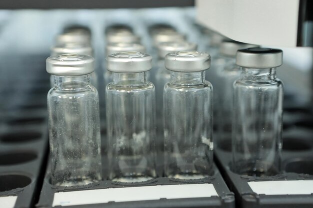 sterile capsules for injection bottles on the bottling line of the pharmaceutical plant