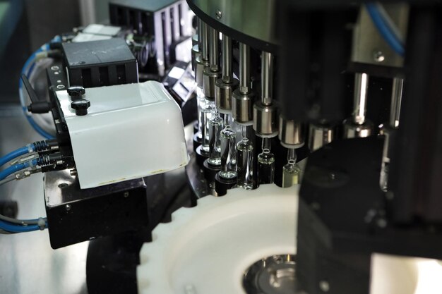 Sterile capsules for injection Bottles on the bottling line of the pharmaceutical plant