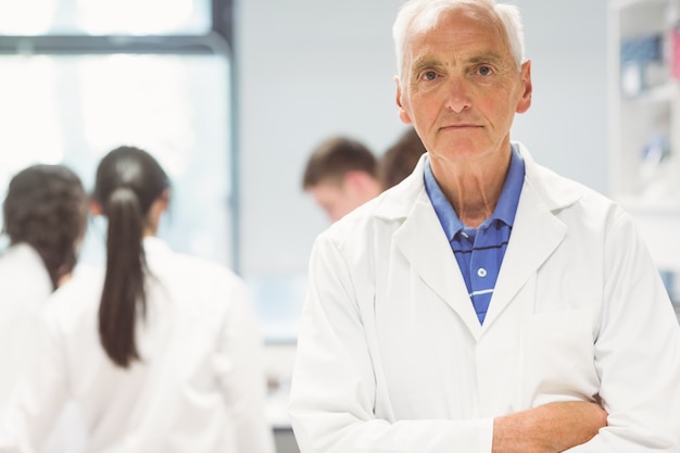 Stern lecturer looking at camera in the lab