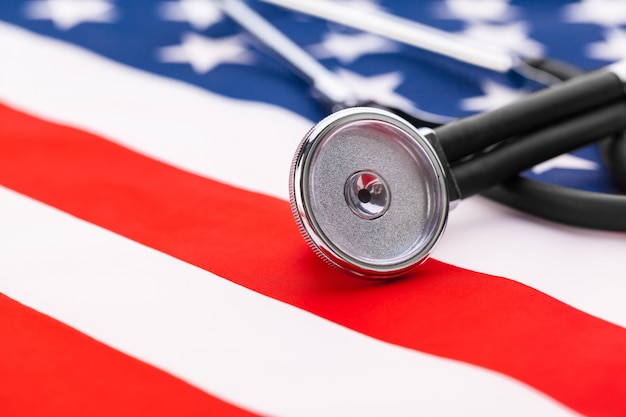 Stethoscope on American national flag, close up