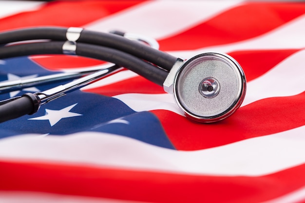 Stethoscope on American national flag, close up