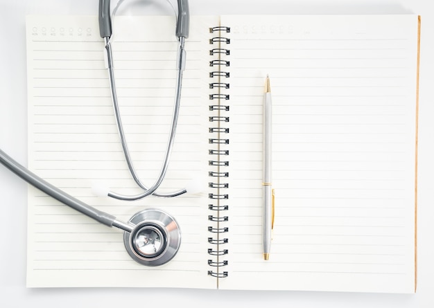 stethoscope on blank notepad arrangement