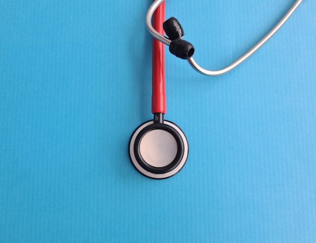 Stethoscope on blue background and medical insurance