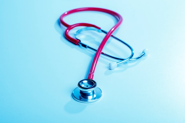 Stethoscope on blue background