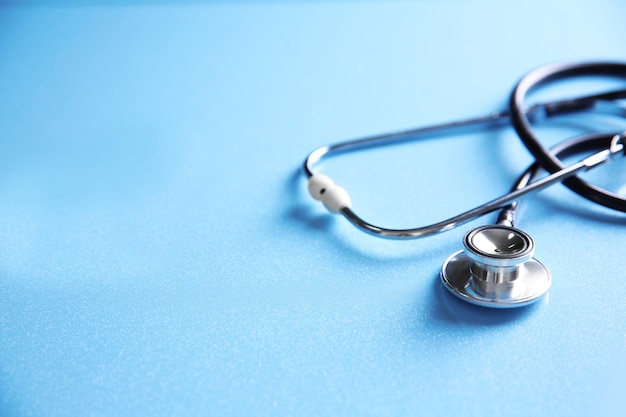 Stethoscope on blue background