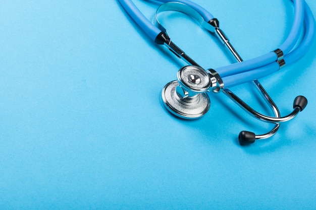 Stethoscope on blue background