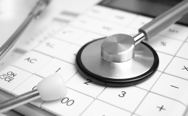 Stethoscope and callculator on the calendar Medical concept