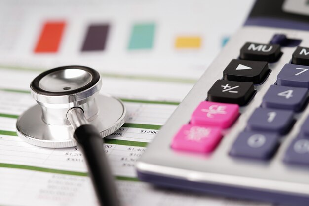 Stethoscope on charts paper with calculator