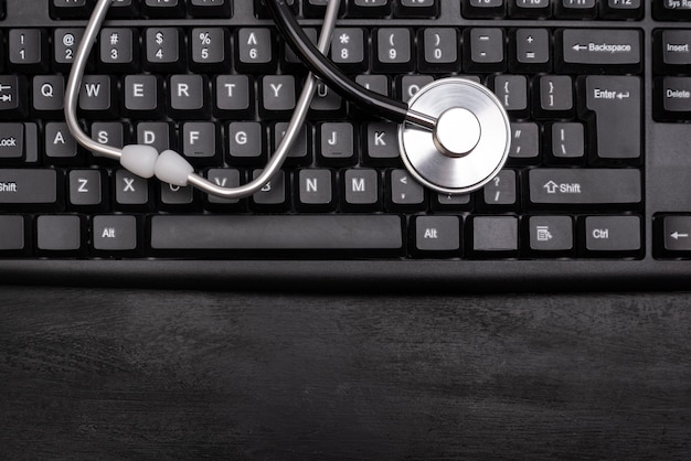 Stethoscope on the computer keyboard. Online consultation with a doctor. Online treatment.