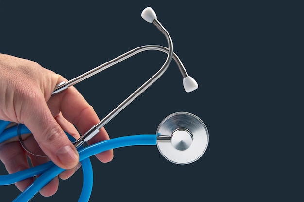 Stethoscope on a dark background heart rate medical instrument