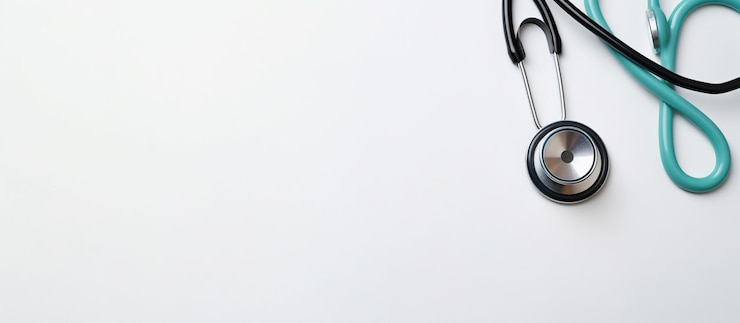 Photo stethoscope on doctor office desk white background