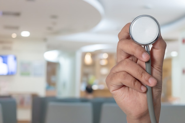 The stethoscope in the doctor's hand helped the patient. Medical and health care 