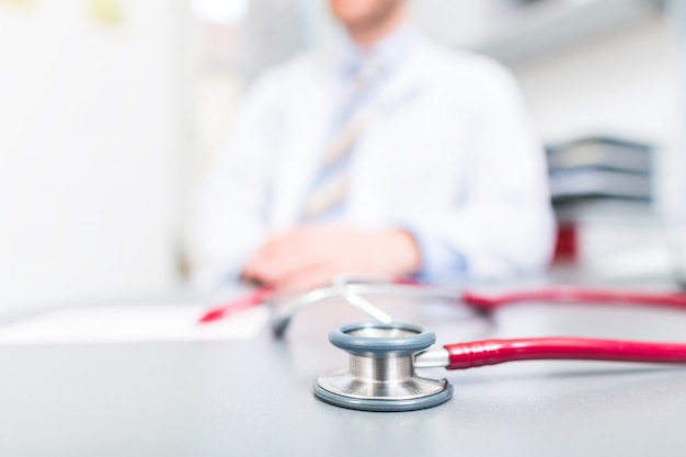 Stethoscope on doctors office desk