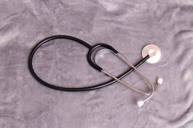 Photo stethoscope on a gray background close up