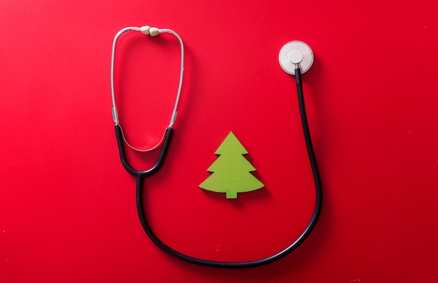 Stethoscope and Handmade toy little Christmas tree