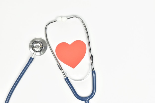 Stethoscope and heart for medical checkup on white background