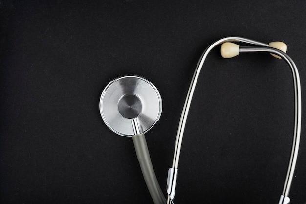 Stethoscope isolated on black background medical instrument