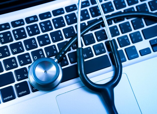 Stethoscope on keyboard laptop