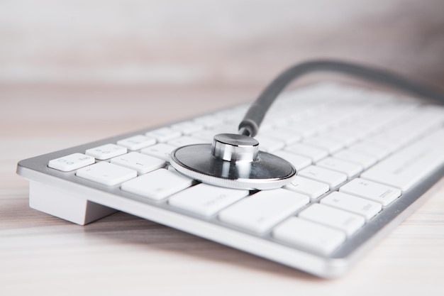 Stethoscope on the keyboard. technical support