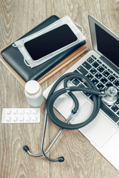 Stethoscope on laptop, close-up