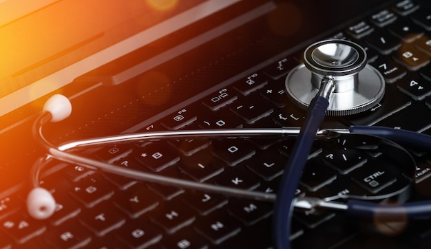 Stethoscope on a Laptop Keyboard Global Medical Technology Diagnostic Concept