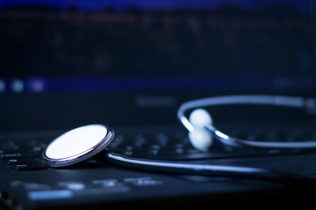 Stethoscope on laptop keyboard.