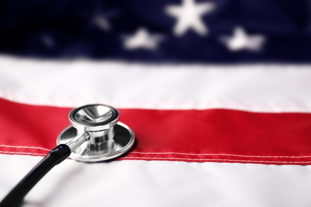 Photo stethoscope on national flag of usa american medicine concept