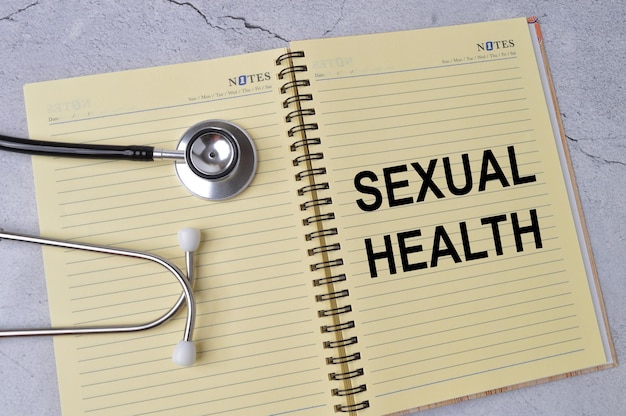 Photo stethoscope and notebook written with sexual health