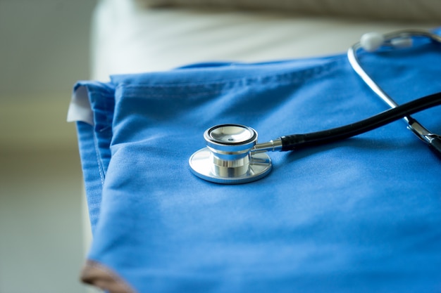 Stethoscope on nurse & doctor coat background