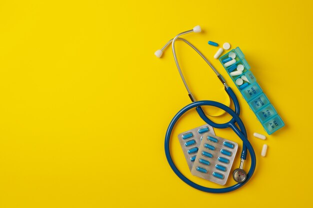 Stethoscope and pills isolated