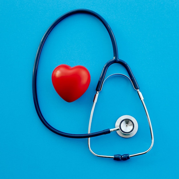 Stethoscope and a red heart on a blue background