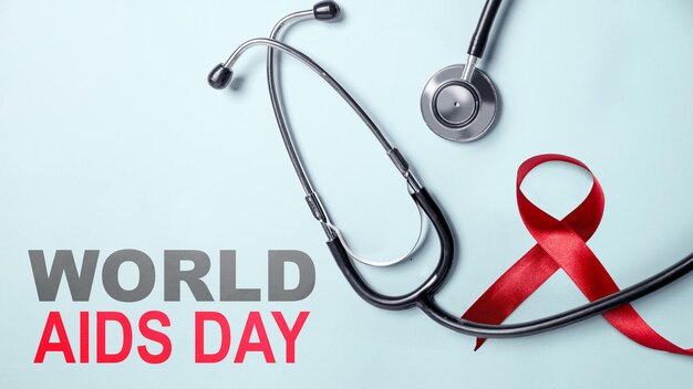 Stethoscope and red ribbon awareness World Aids Day concept