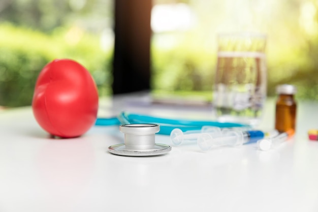 Photo stethoscope syringe and medical equiupments with vaccine on table healthcare and medicine concept