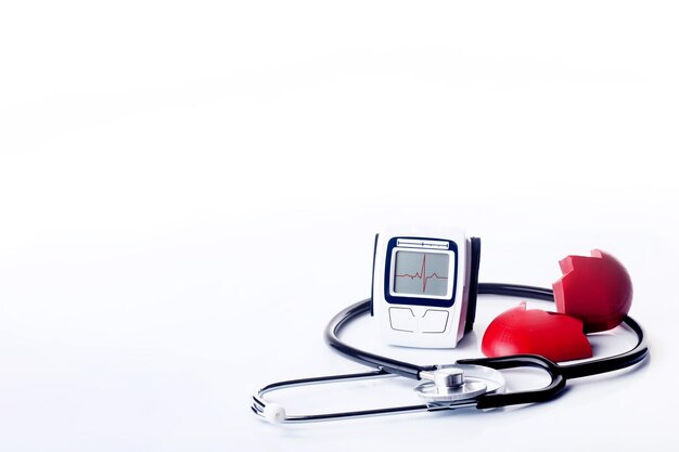 Stethoscope tonometer and destroing heart on white background Time to book a Heart Health Check