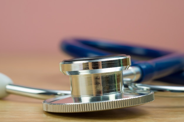 Stethoscope with blue tube on table, health and medical concept.