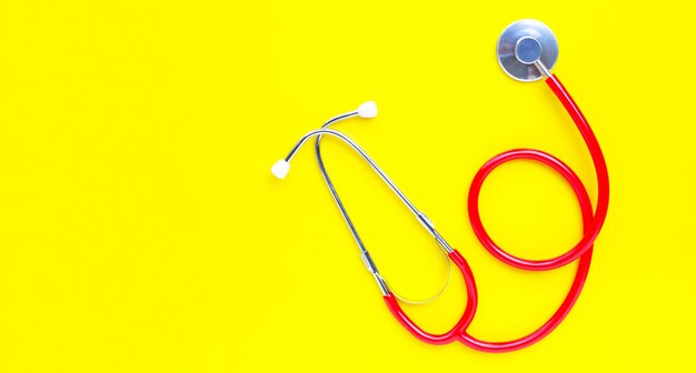 Photo stethoscope on yellow background. copy space