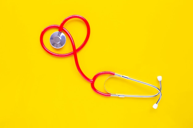 Stethoscope on yellow background