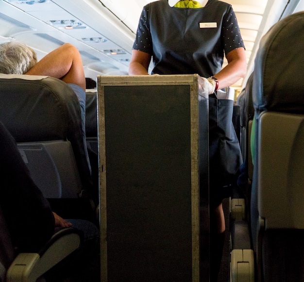 Photo stewardess in the cabin aircraft