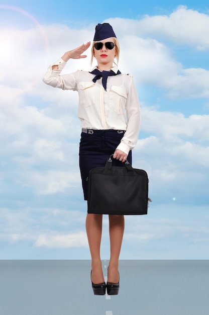 Stewardess standing on runway