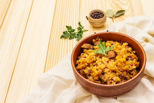 Stewed (braised) cabbage served on ethnic ceramic bowl