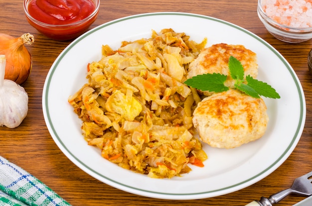 Stewed cabbage, meat cutlets, spices and salt